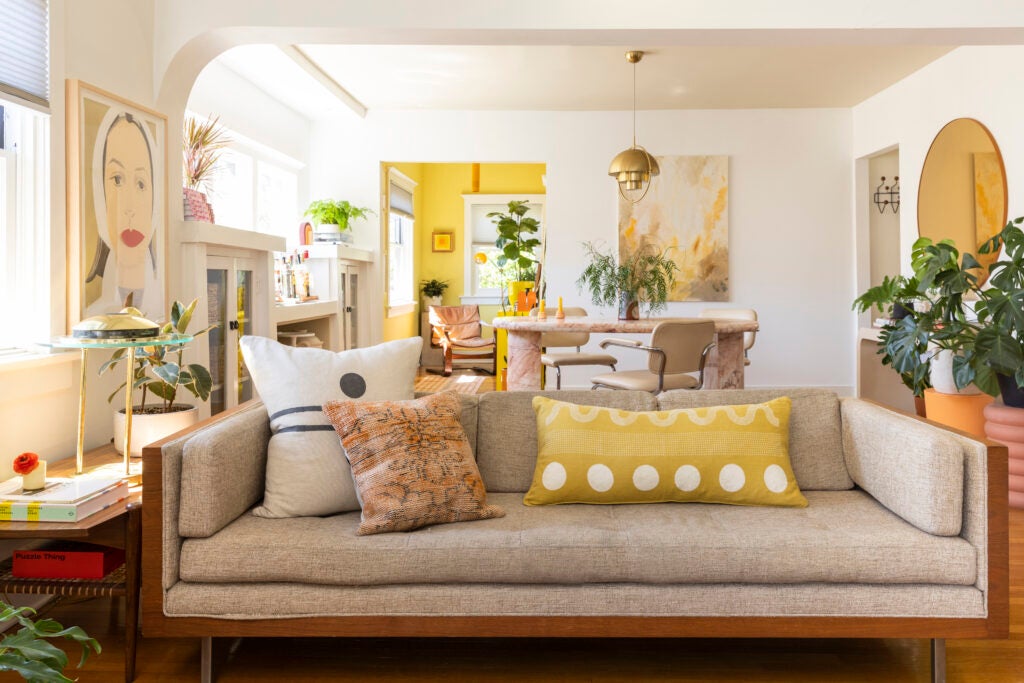 Living room with yellow pillows on sofa