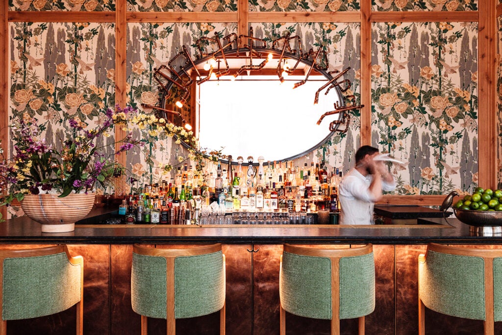 bar with floral wallpaper.