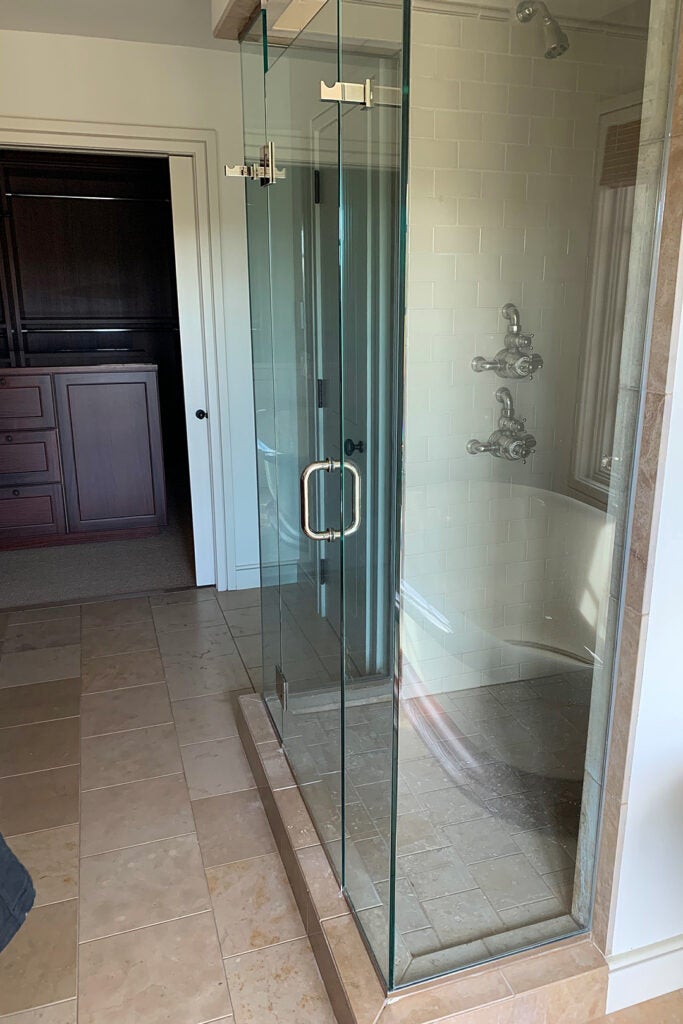 dated glass enclosed shower