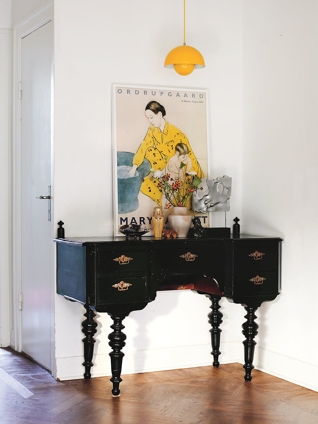 console table with yellow pendant light