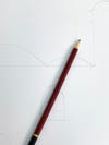 pencil sitting on white paper