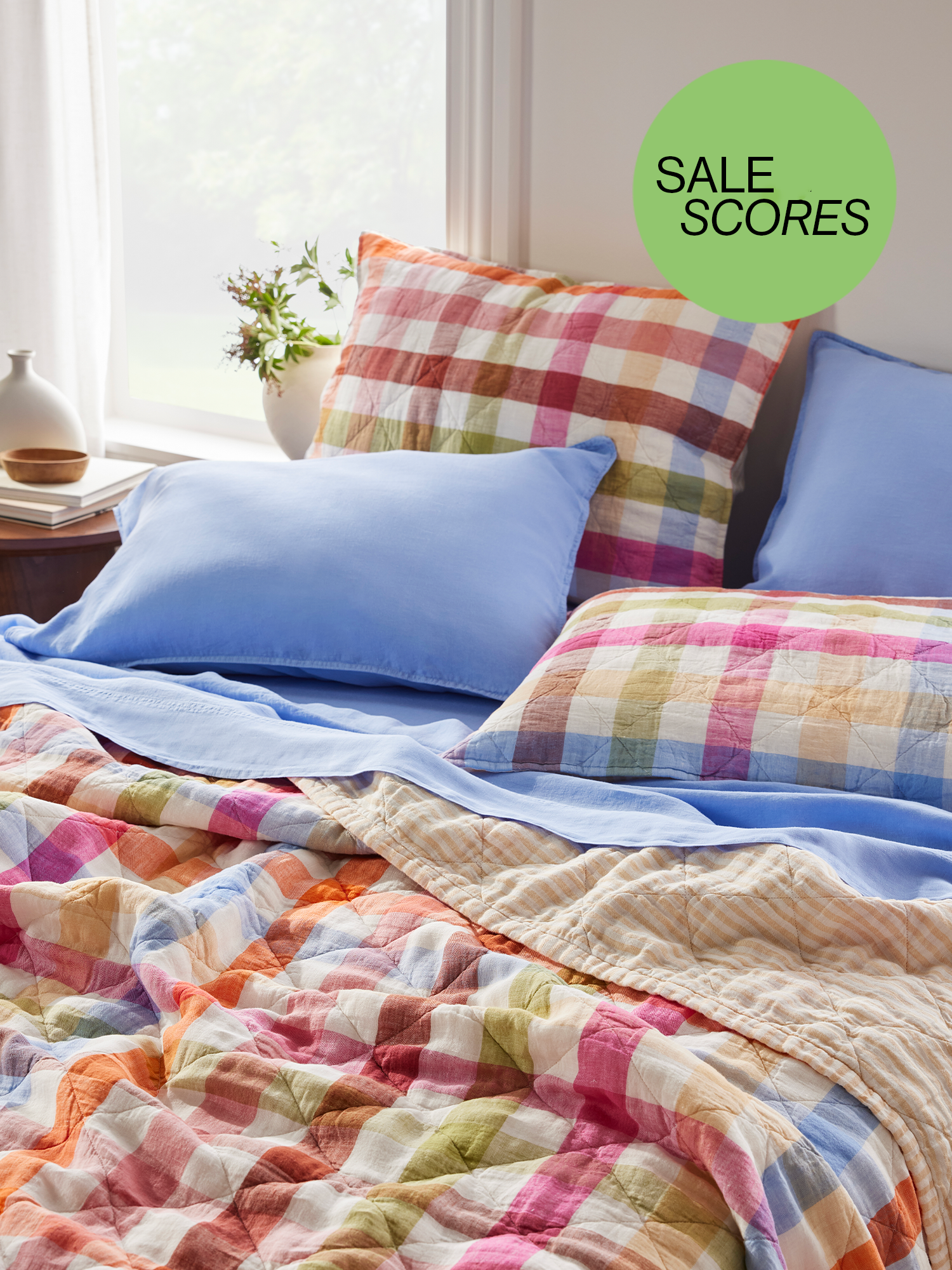 Brooklinen rainbow check quilt and blue sheets with sale scores button