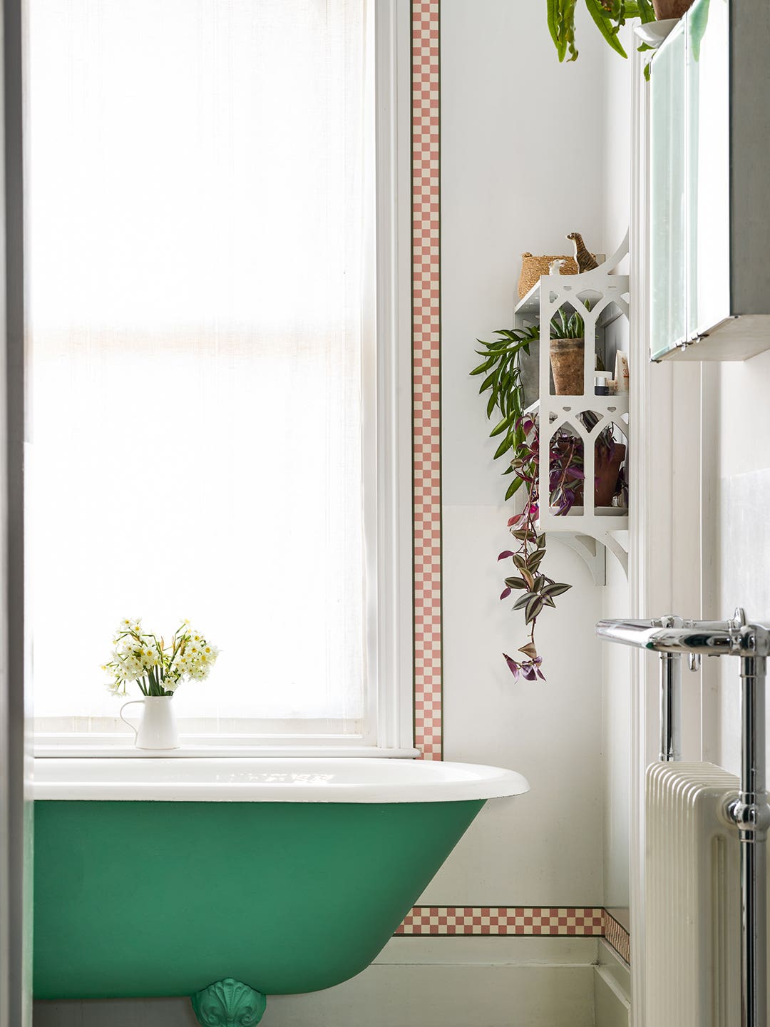 bathroom with green clawfoot tub