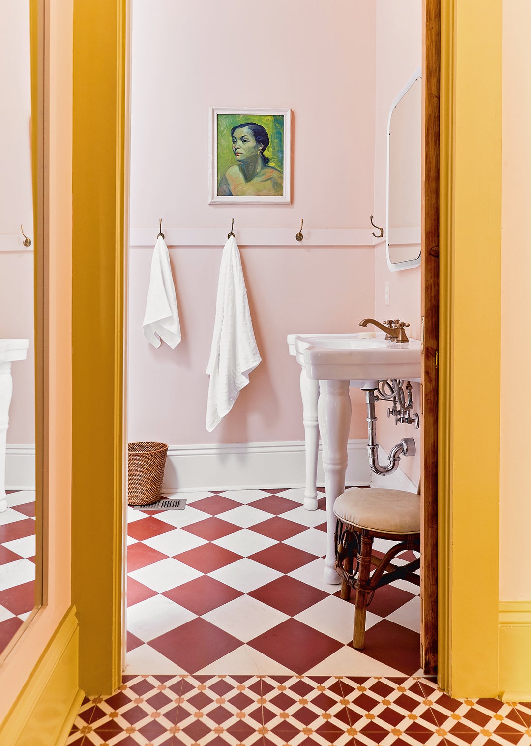 pink bathroom with checked floors