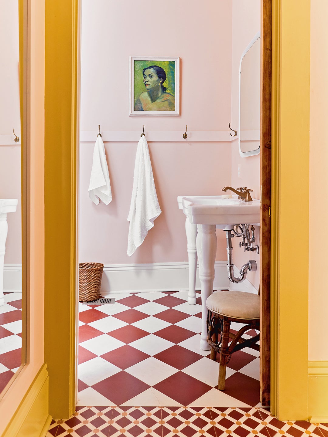 pink bathroom with checked floors