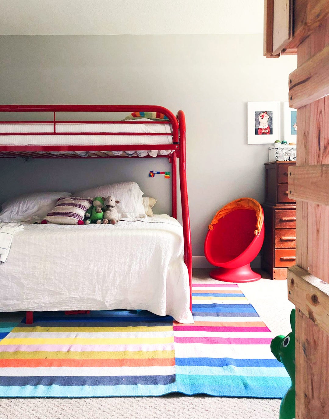 red-framed bunk beds in kids' room