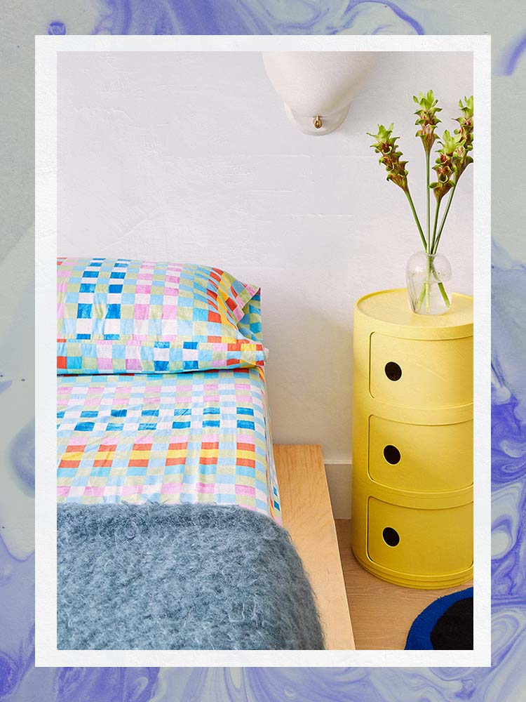 Colorful bedroom with yellow Componibili Kartell side table