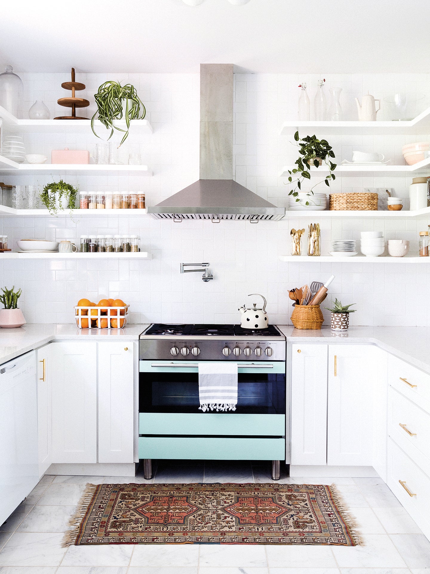 white kitchen with seafoam green stove