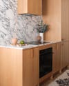 oak cabinets with bold marble
