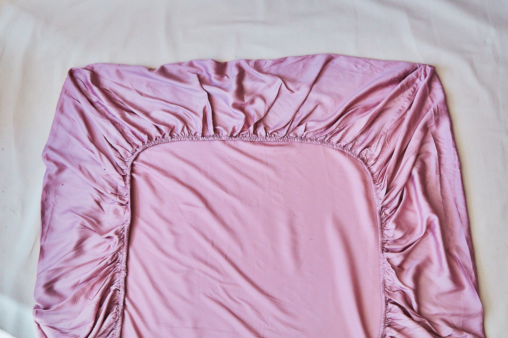a pink fitted sheet spread out