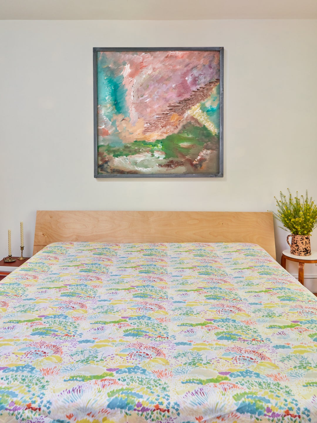 mattress with flower-print flat sheet