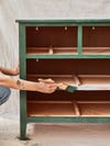 painting a wooden dresser drawer frames green
