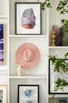 pink hat in gallery wall