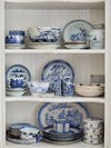 shelves of blue and white porcelain plates.