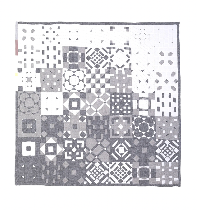 grey patchwork quilt