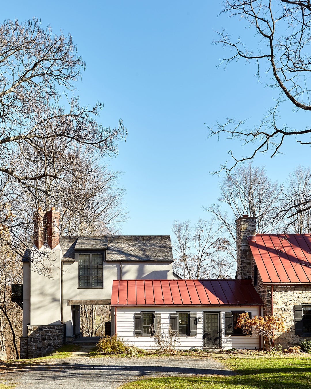Red metal roof and exterior shot of all three homes