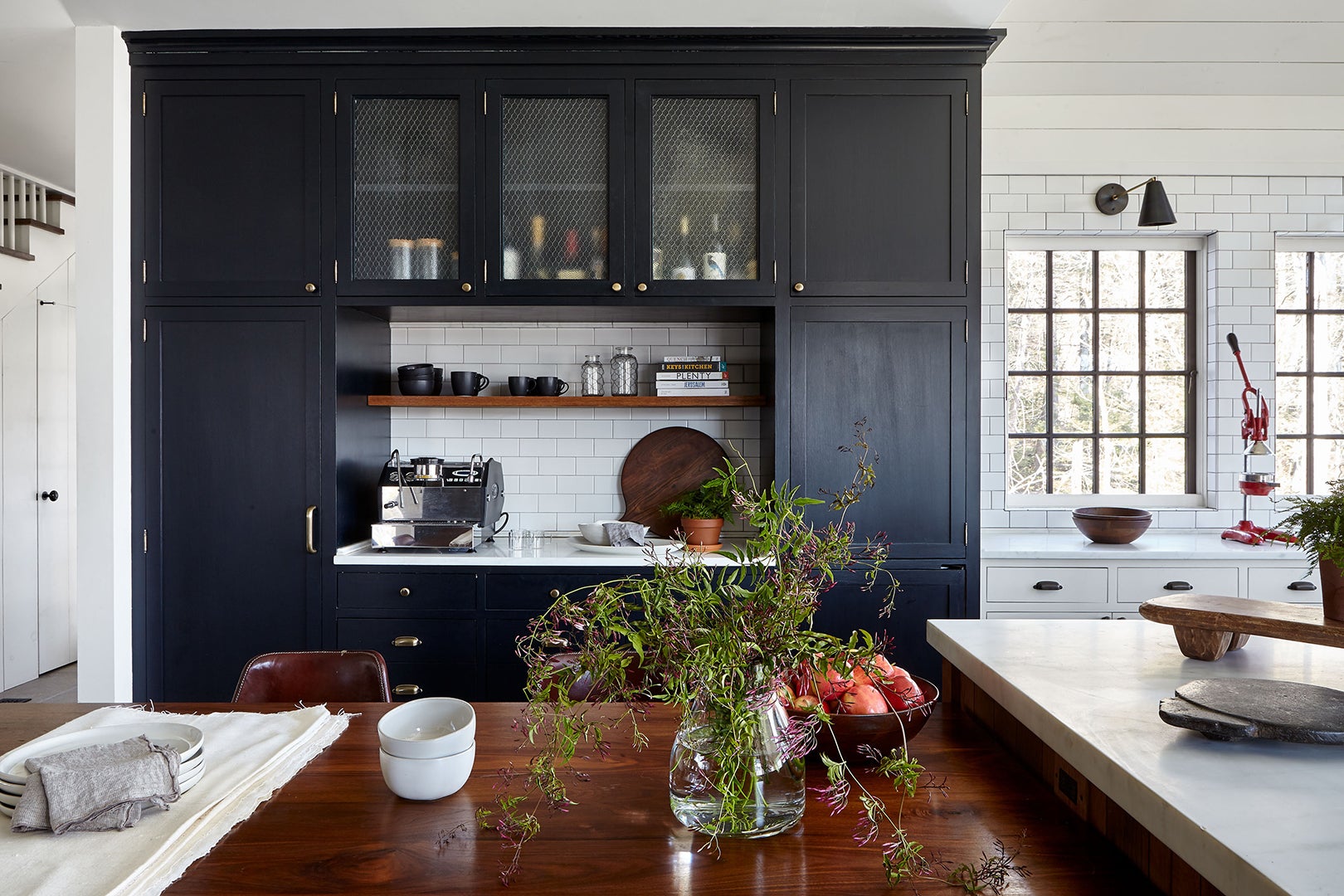 Blue kitchen cabinets and white subway tile