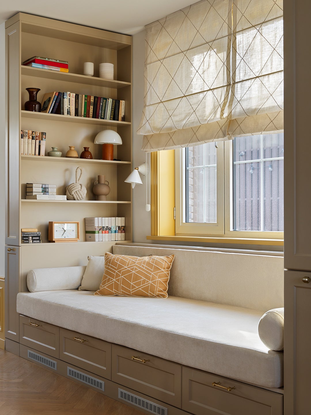 bench nook surrounded by shelves