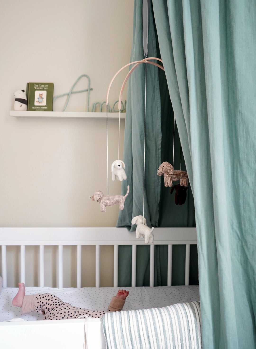 pale green fabric canopy over crib