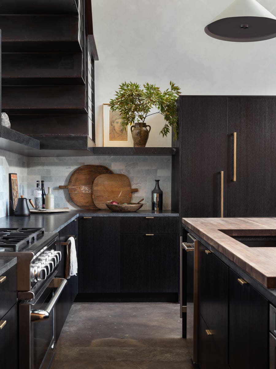 kitchen with black cabinets and counters
