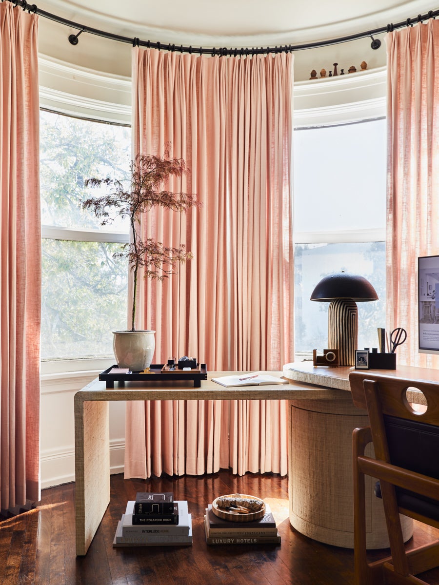 home office with pink curtains