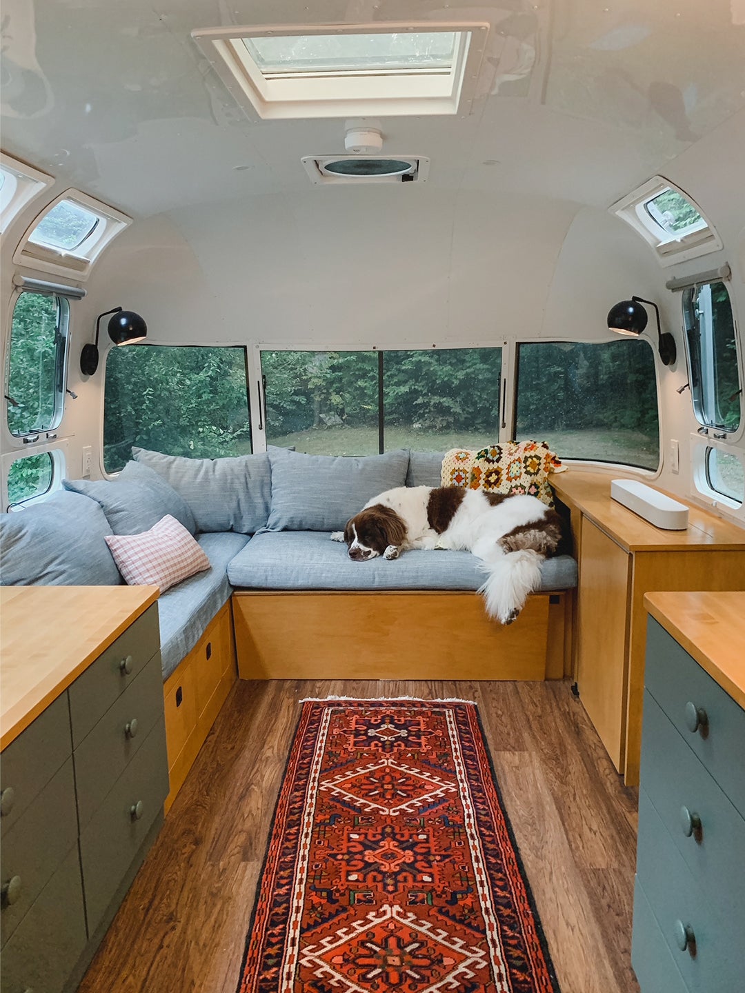 A Powder Blue Banquette and Green Cabinetry Prove That Caravans Can Still Be Stylish