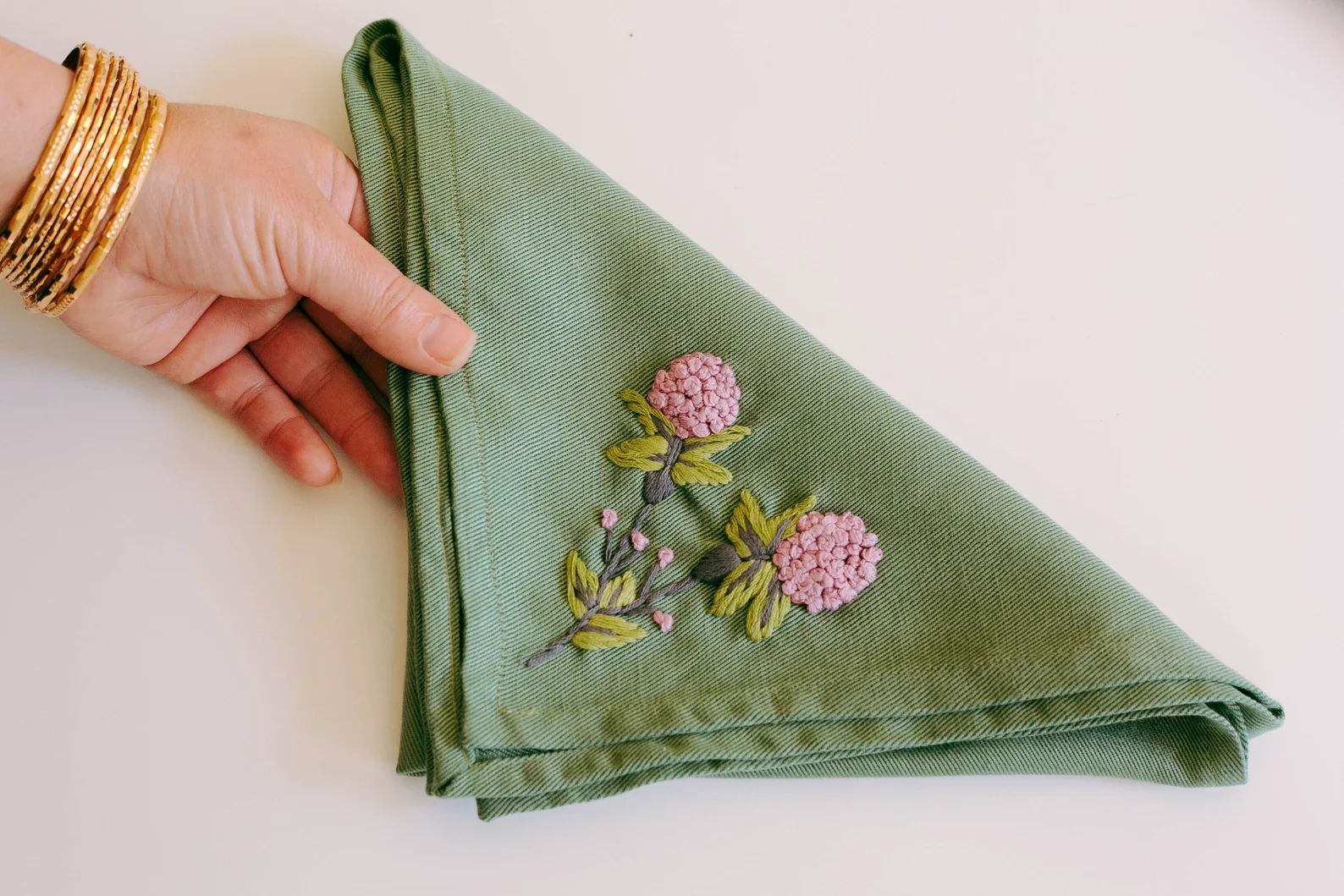 green hand embroidered napkin