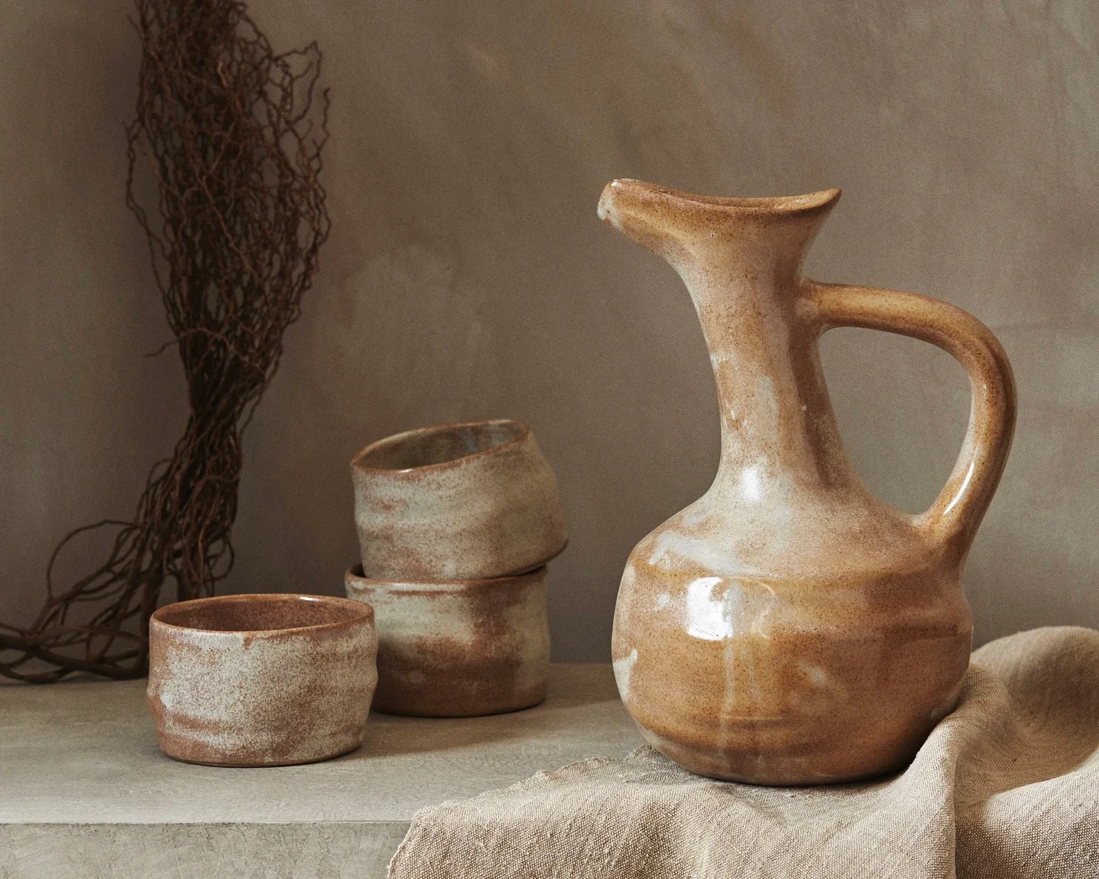 ceramic pitcher and cups