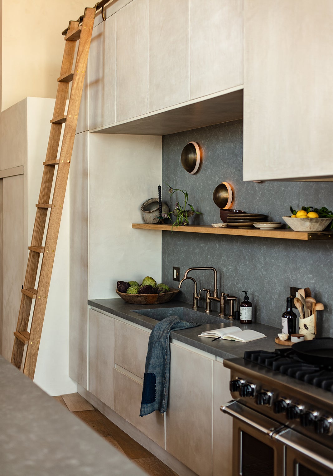 kitchen with plaster cabinetry and library ladder
