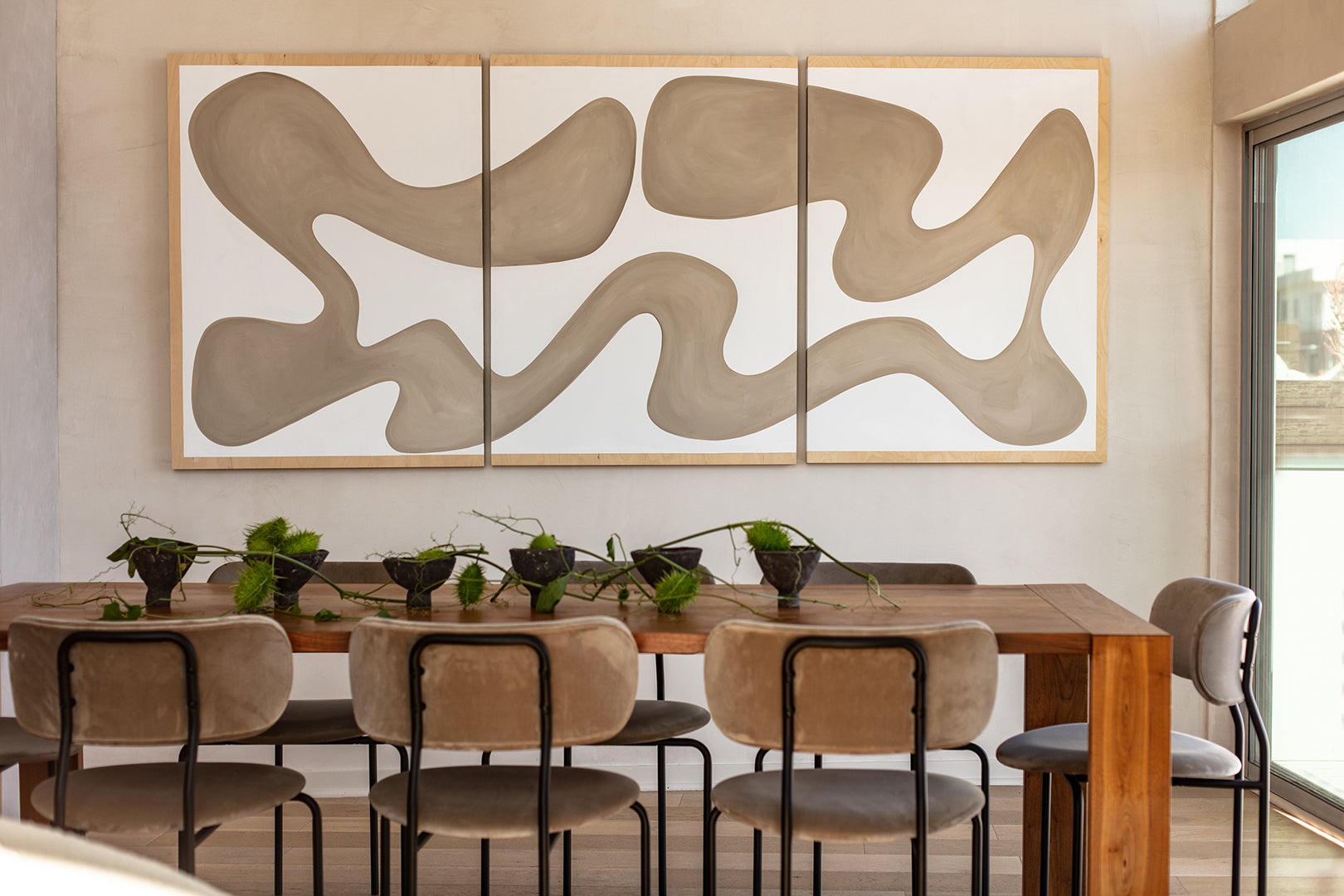 dining room with brown squiggly artwork