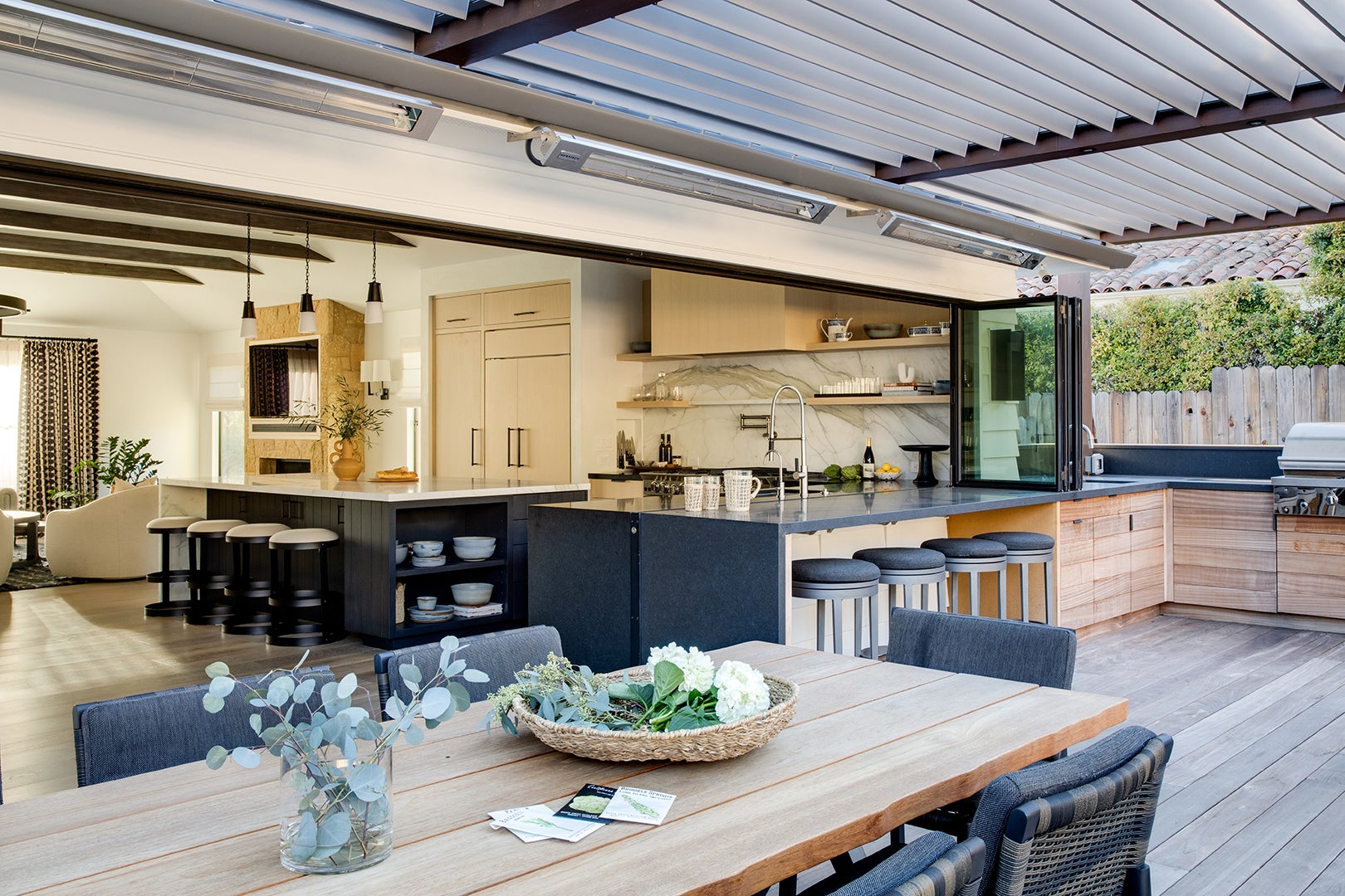 indoor outdoor kitchen with louveredceiling