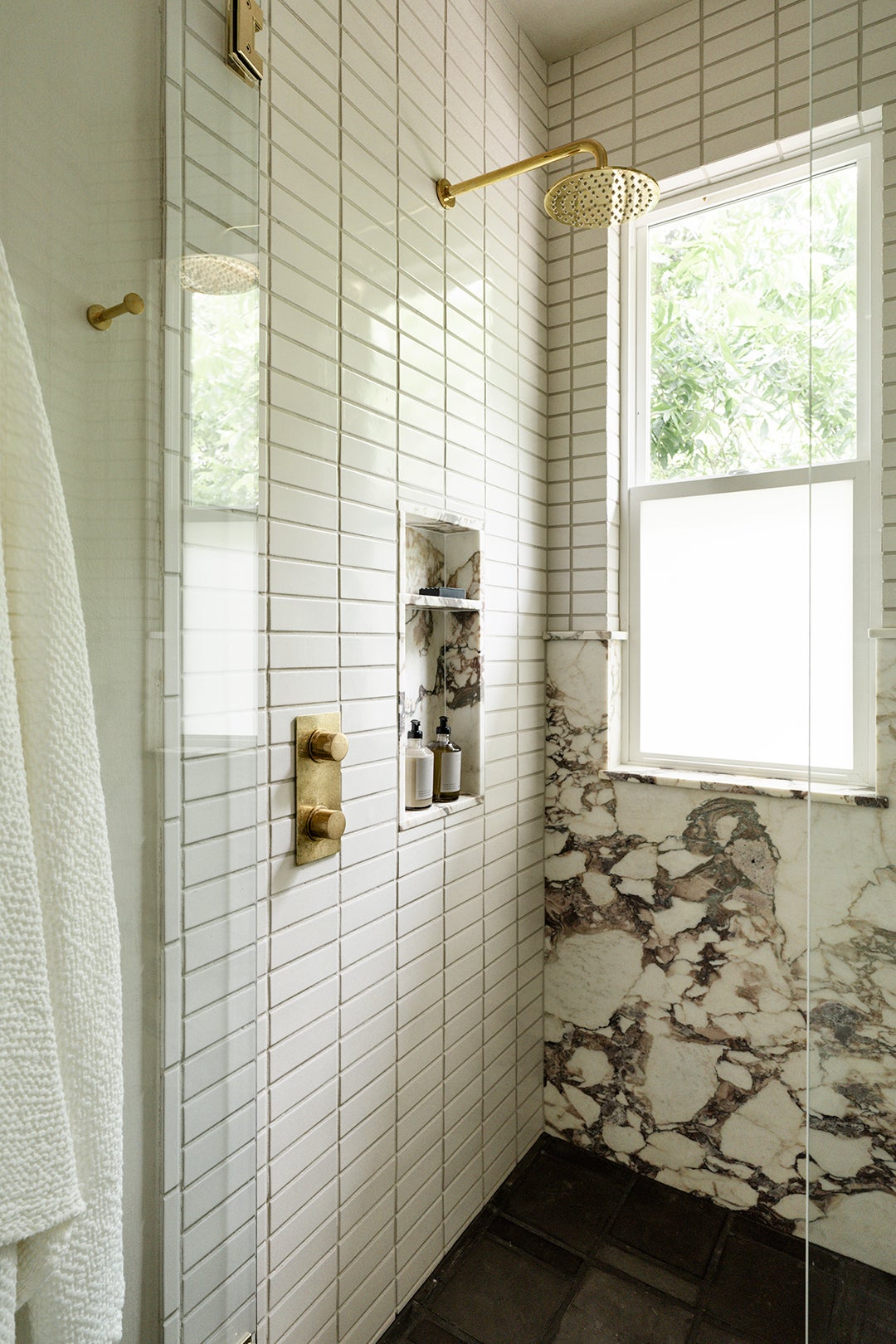 white tiled shower wall