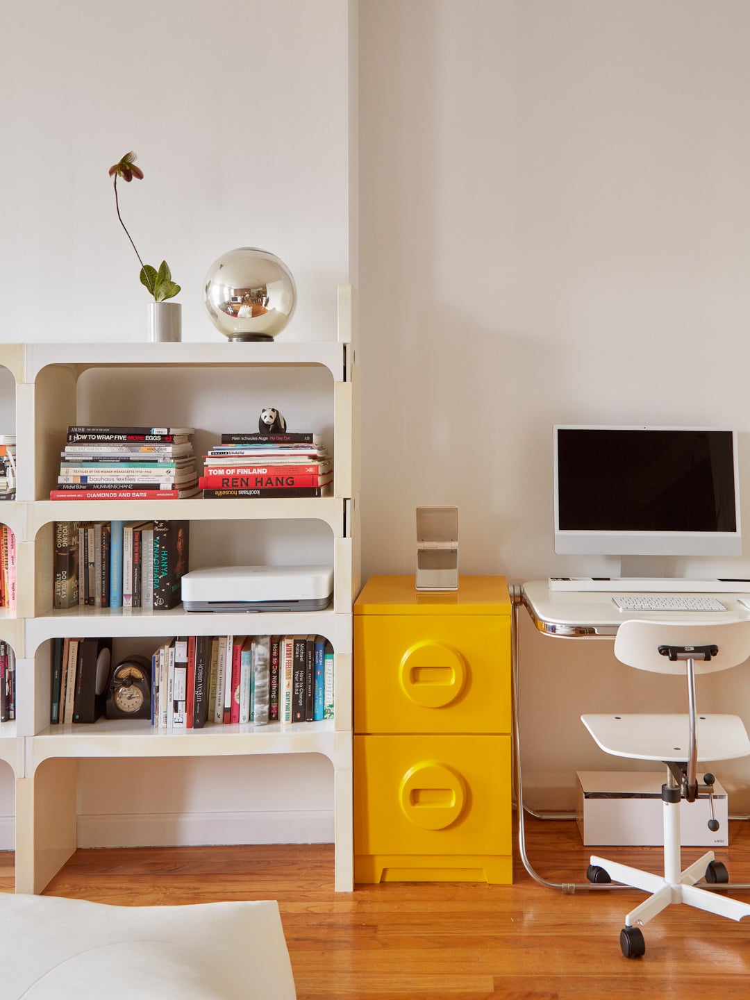 Studio apartment with yellow file cabinets