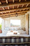 patio with stone walling wooden exposed beam ceiling