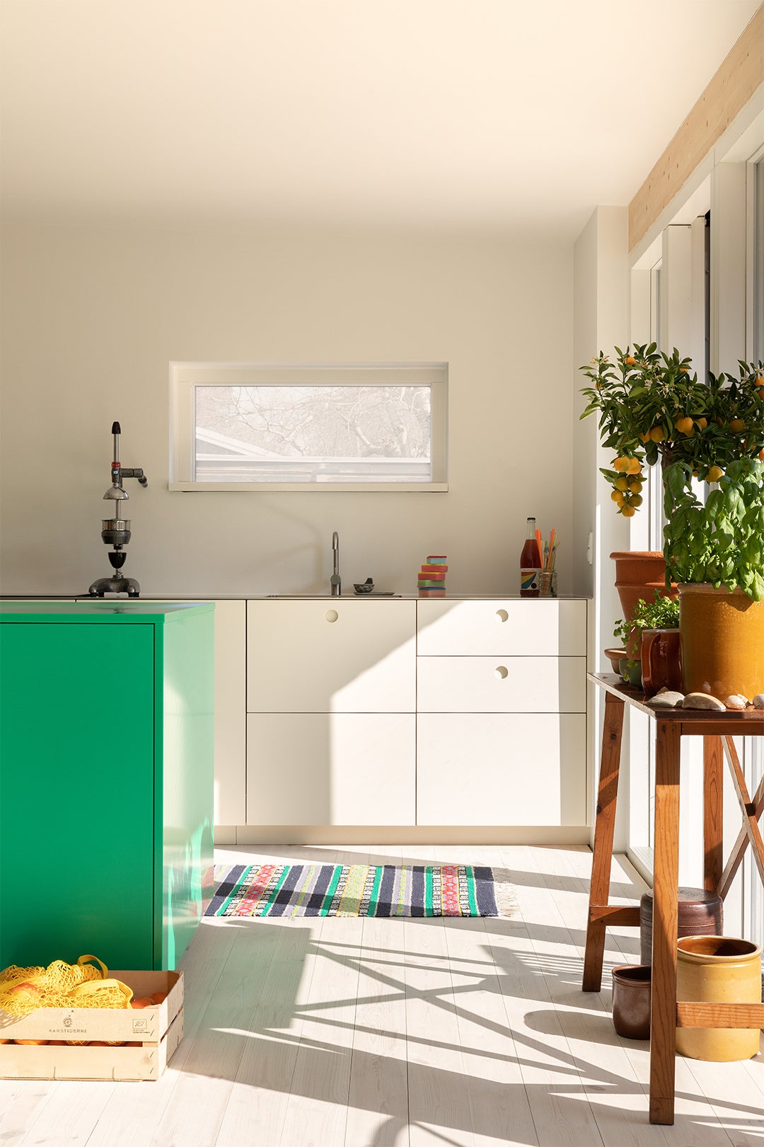 The Kelly Green Island in This Danish Kitchen Is Made From the Same Material as Cutting Boards