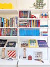 slanted Ikea show shelves displaying books