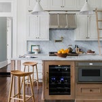 kitchen with marble island and wooden stools