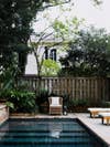 backyard with pool and wooden fence
