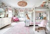 bunk bed room with floral wallpaper