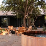 backyard with flagstone patio and sunken hot tub