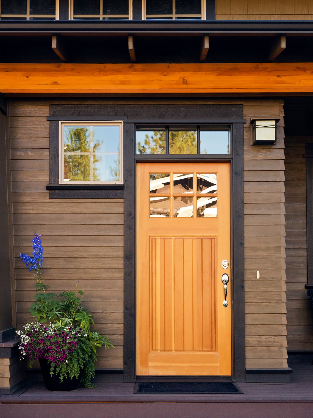 brown home exterior with wood door