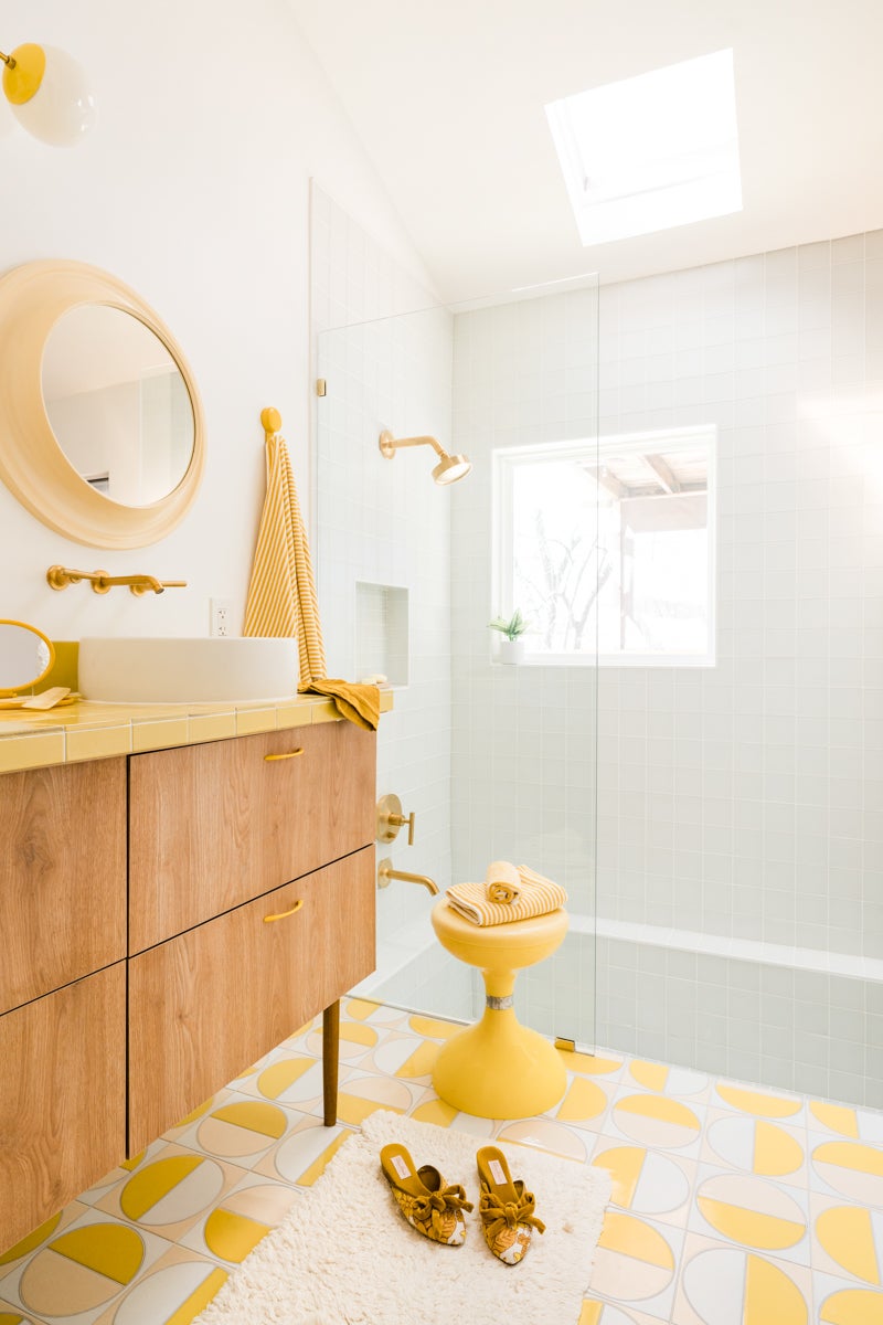 yellow retro bathroom with glassed-in shower