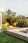 backyard with bright yellow patio furniture