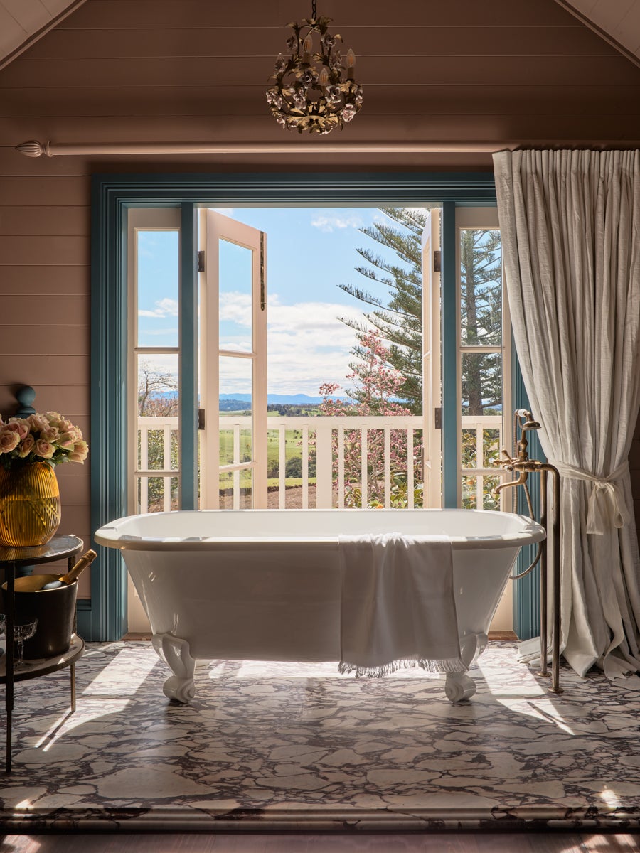 clawfoot tub looking out onto a balcony