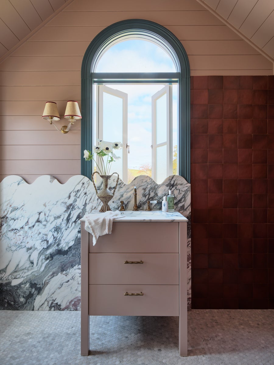 pink bathroom with scalloped marble