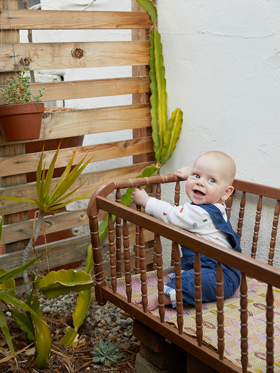 baby in crib in garden