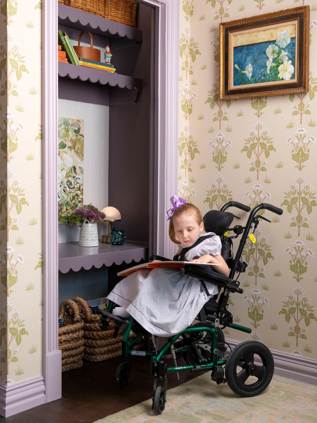 child in wheelchair at scalloped purple desk
