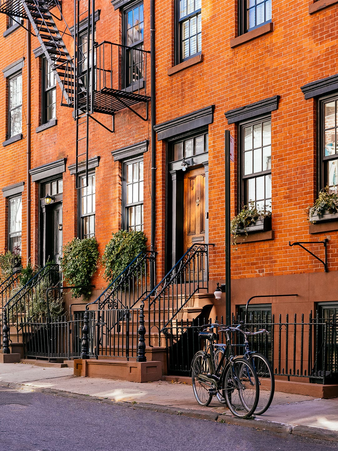 city brownstone with bike out front