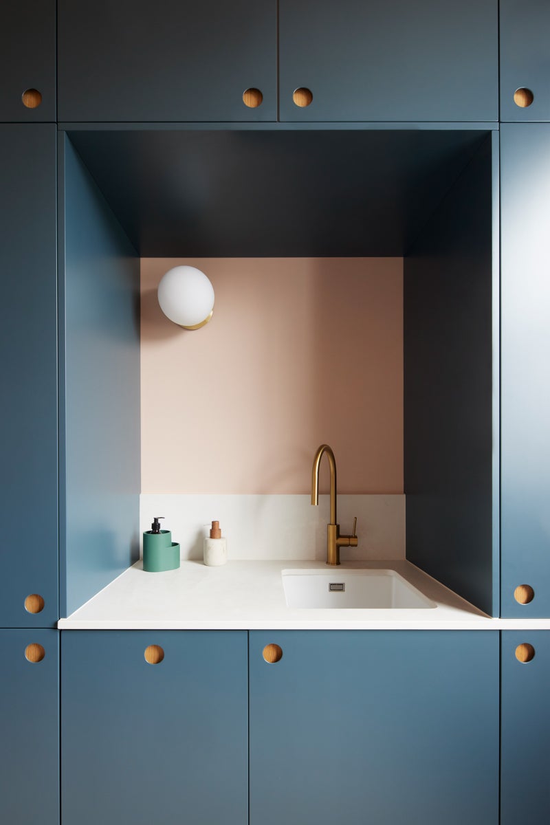 blue cabinets around sink