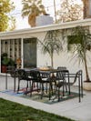 concrete patio with outdoor rug and patio dinette set